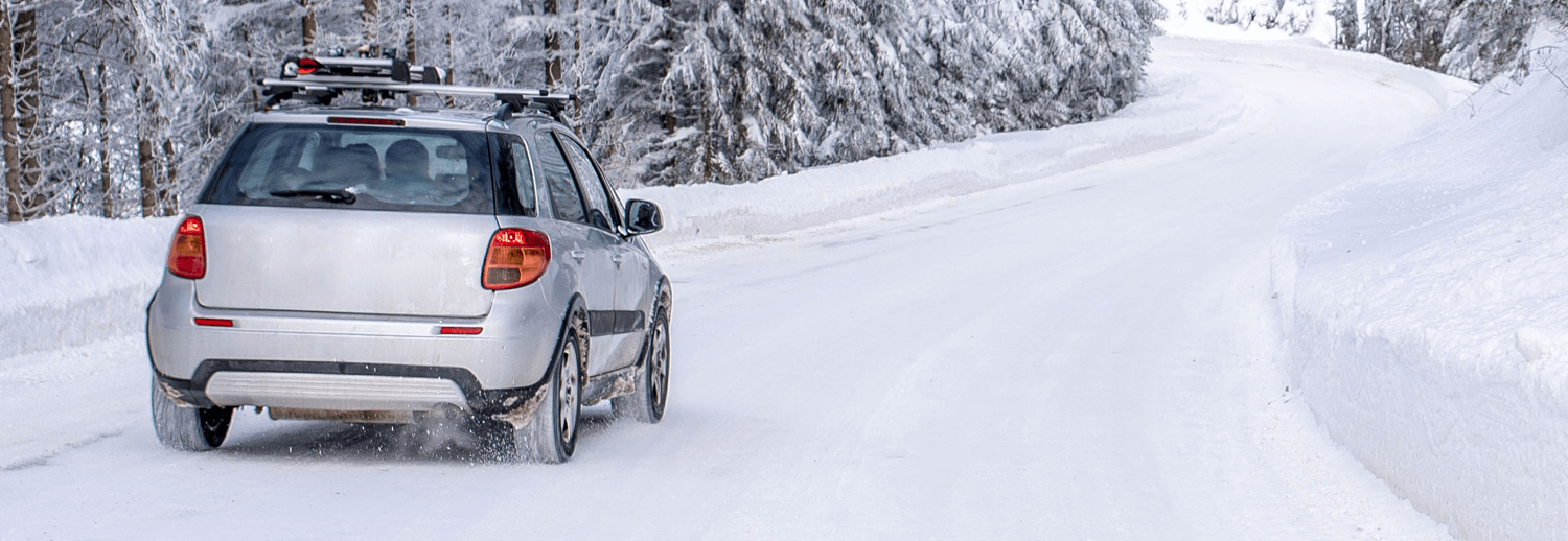 a car driving in the snow in winter